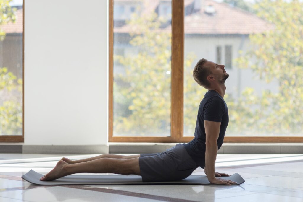 Man doing Cobra Pose - The Bhujangasana